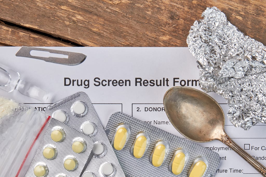 Drug screen result form flat lay drug testing paraphernalia pre-employment screening