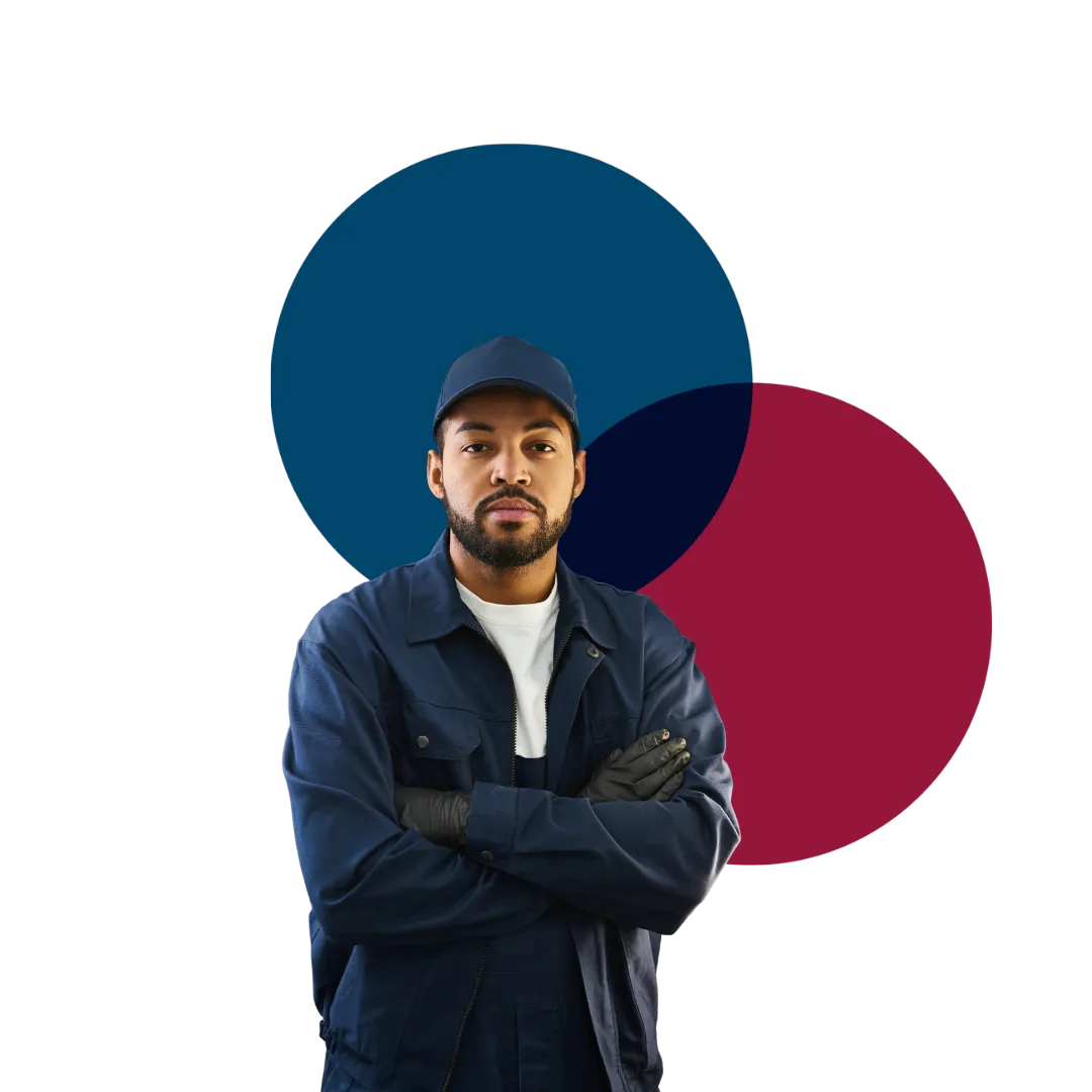 Confident automotive service professional in navy workwear jacket and cap with brand crimson and teal circle backdrop