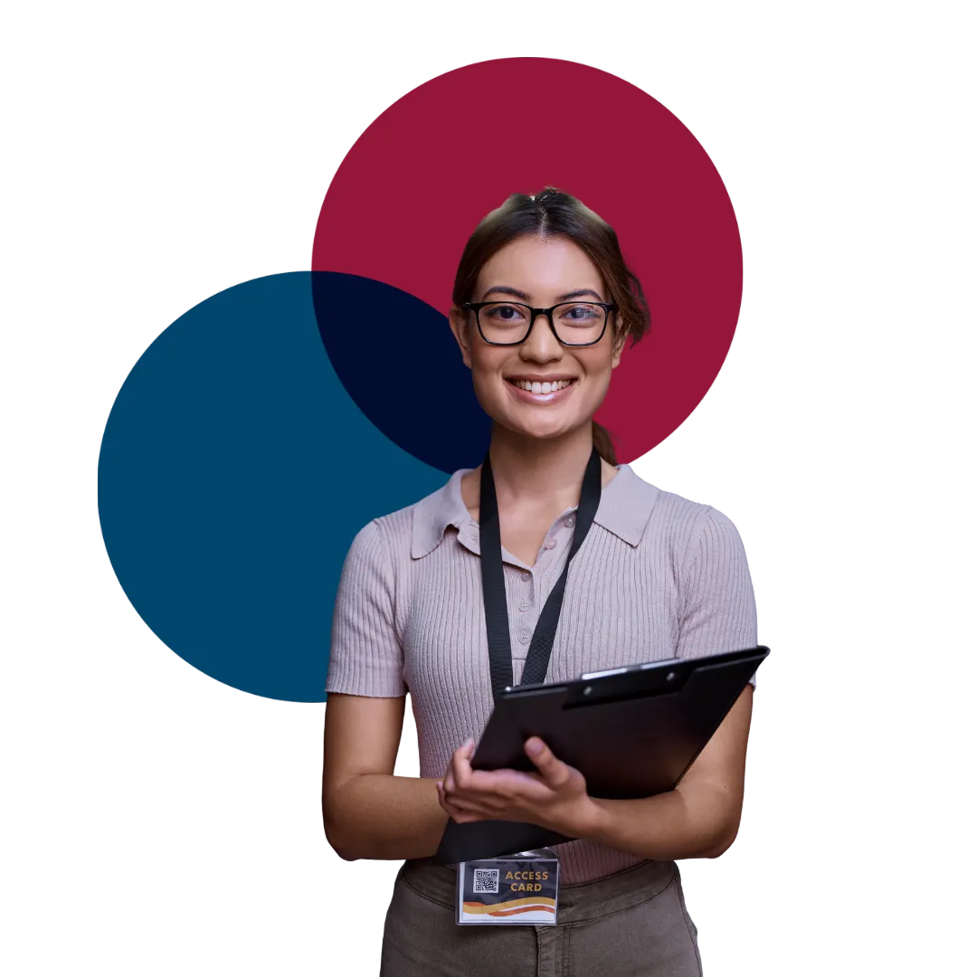 A vetted employee holding an access badge and clipboard, the kind of trusted hire background screening makes possible.