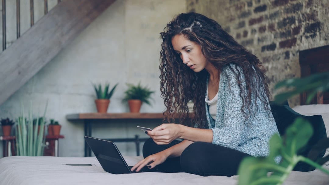 Person reviewing personal records online, representing a clear view of what employers see.